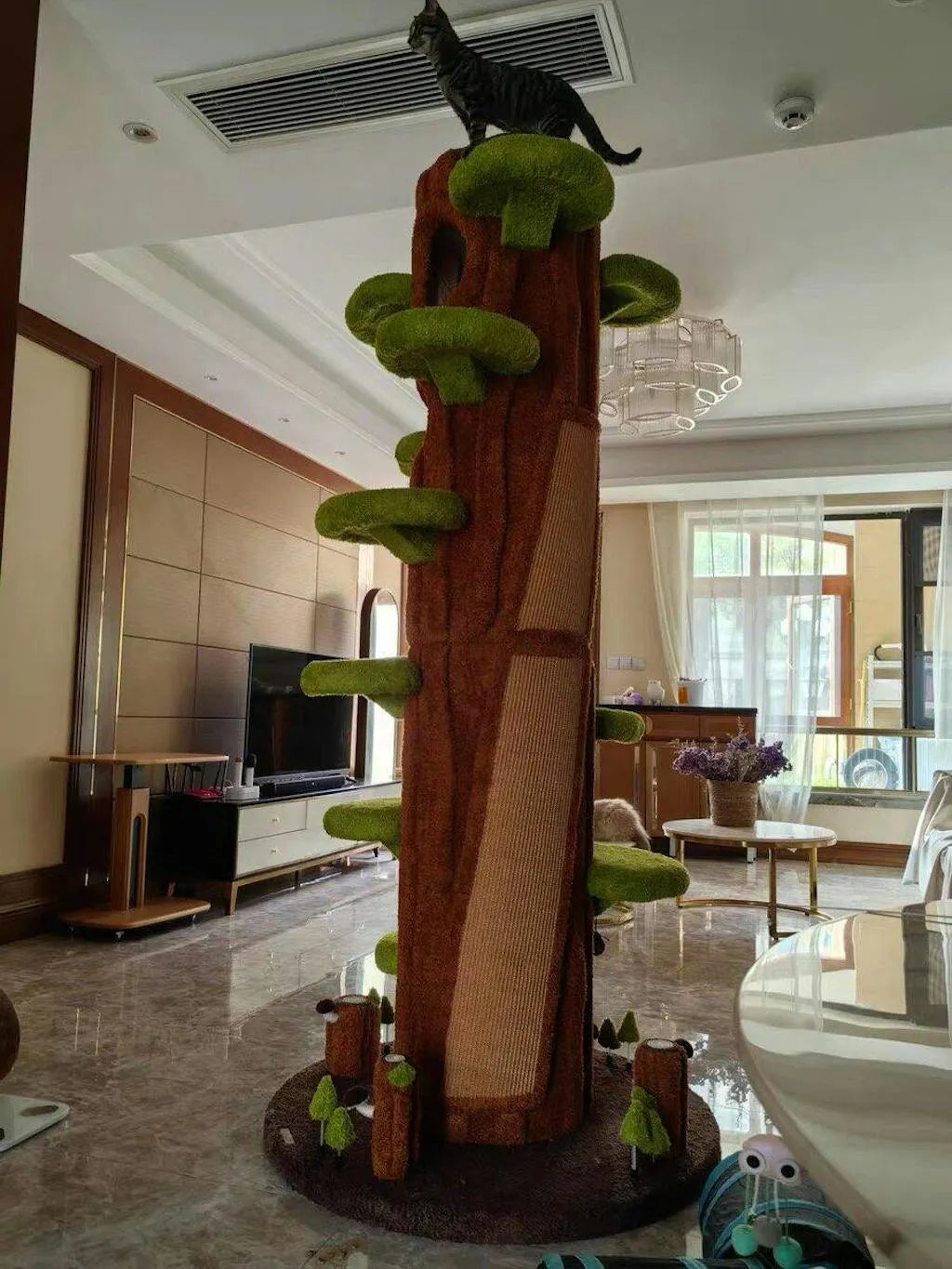 Rear view of the Green cat tower showing the trunk and rear surface