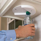 White fixed opener shown with a bottle